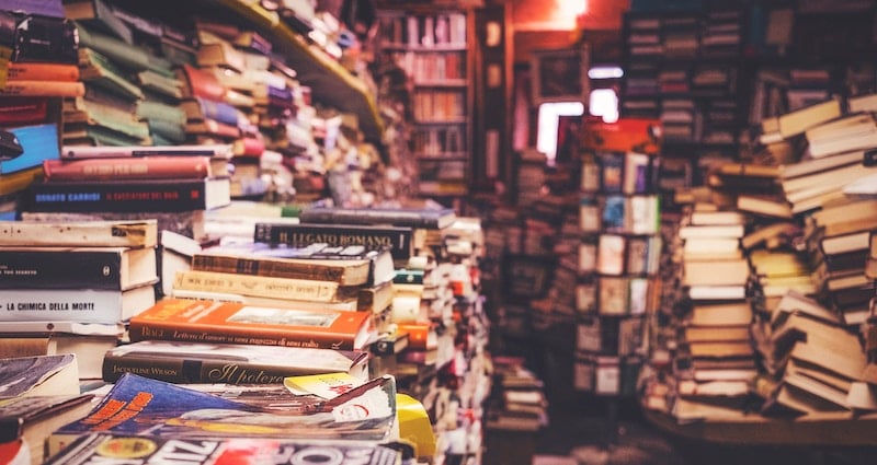 Disorganized stacks of books