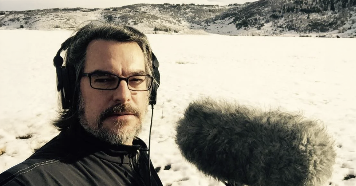 Sound Artist Eric Potter holding a shotgun microphone